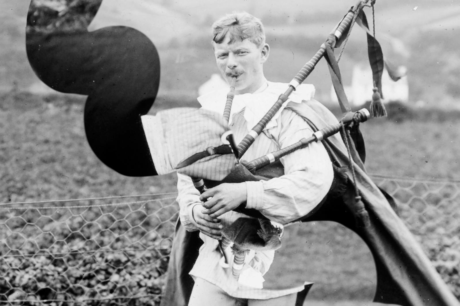 manipulated black and white photograph of man playing pipes